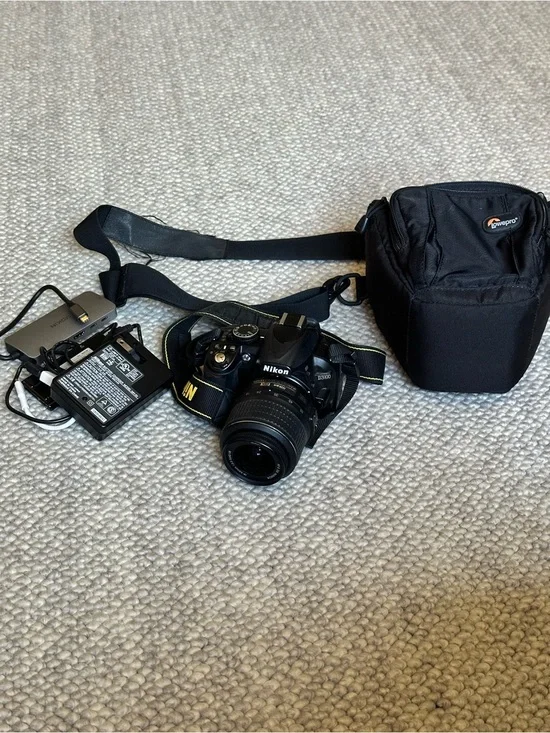 Nikon Black DSLR Camera with Black Lens and Strap