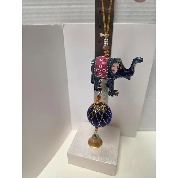 handcrafted Indian-style decorative elephant hanging, likely made from wood