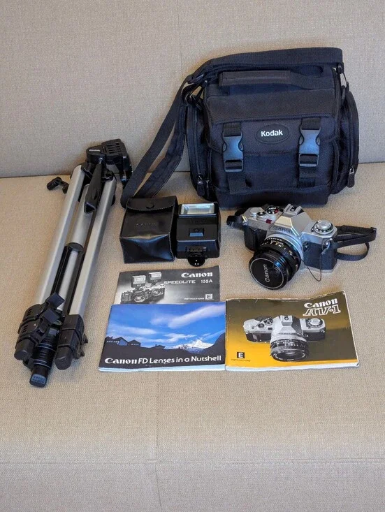 Vintage Canon AV-1 35mm Film Camera Bundle w/ FD 50mm Lens & Speedlite Flash