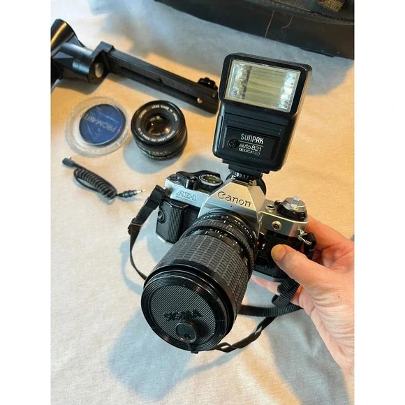 Canon‎ AE-1 Program 35mm SLR Film Camera Bundle with 50mm Lens Flash and Bag