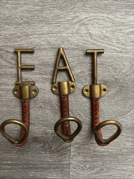 Anthropologie Gold 'EAT' Wall Hooks with Brown Leather Straps