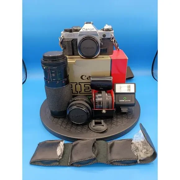 Canon ae-1 program With Extra Lenses, Original Box, Papers And Carrying Case
