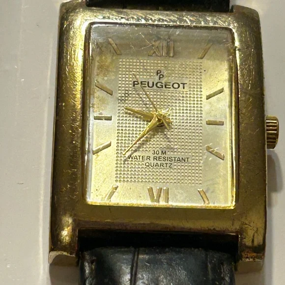 Peugeot Gold and Black Timepiece