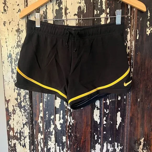 Vintage Livestrong Nike Black and Yellow Women's Athletic Shorts. Size small.