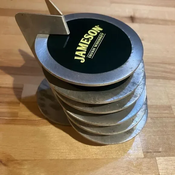 Six metal Jameson coasters, great condition, come with small rack