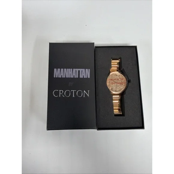Croton Manhattan watch features a gold-tone design