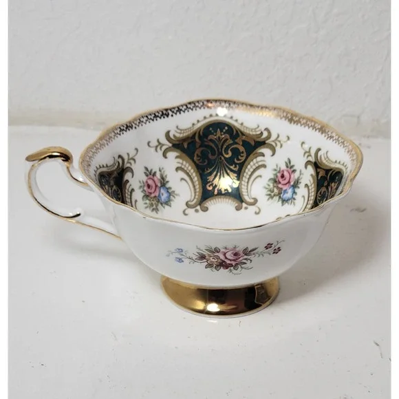 Paragon teacup - dark green panels on white background with floral‎ decor...Read
