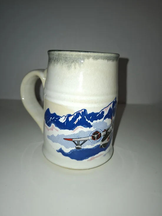 Cream Ceramic Airplane Mug with Blue Mountain Scene