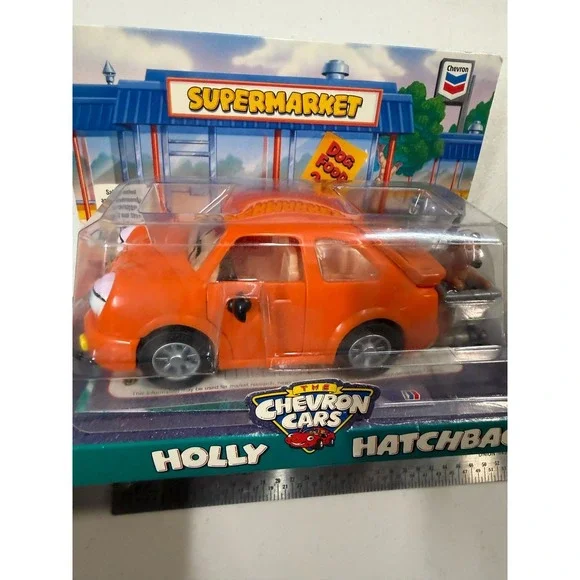 The Chevron Cars Holly Hatchback Orange Toy Car with Dog and Shopping Cart 1997