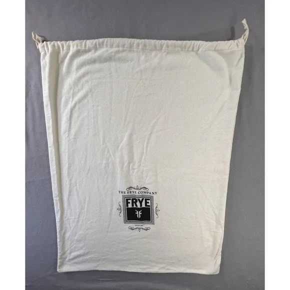 The Frye Company‎ cream-colored cotton dust bag with a drawstring closure boots