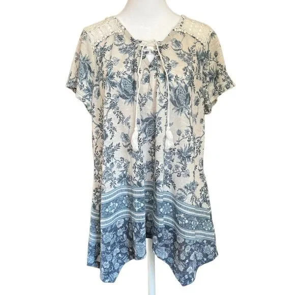 Flowy knit top with lace shoulder accent