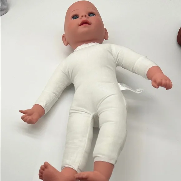 Realistic Baby Doll with White Outfit