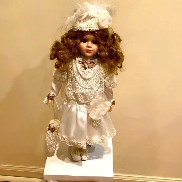 Porcelain doll with satan and lace trim dress with umbrella 15 inches