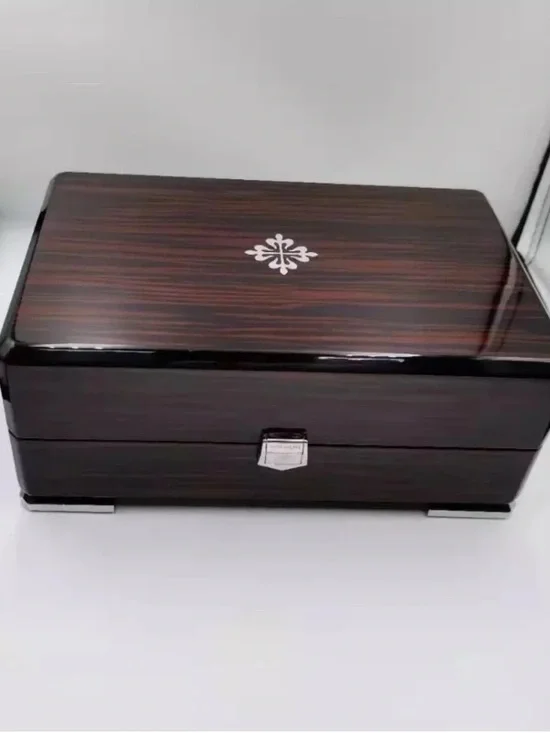 Patek Philippe Brown and Black High-Gloss Wood Watch Box with Silver Emblem