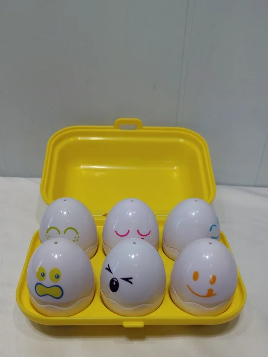 Tomy Yellow Egg Toy Set with Assorted Face Expressions Matching Colors Shapes