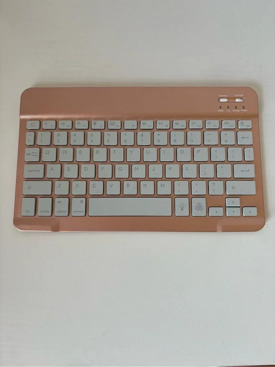 Compact Rose Gold Wireless Bluetooth Keyboard with White Keys