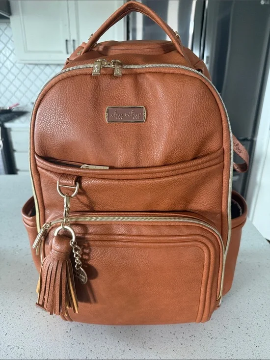 Itzy Ritzy Cognac Vegan Leather Backpack with Tassel Charm
