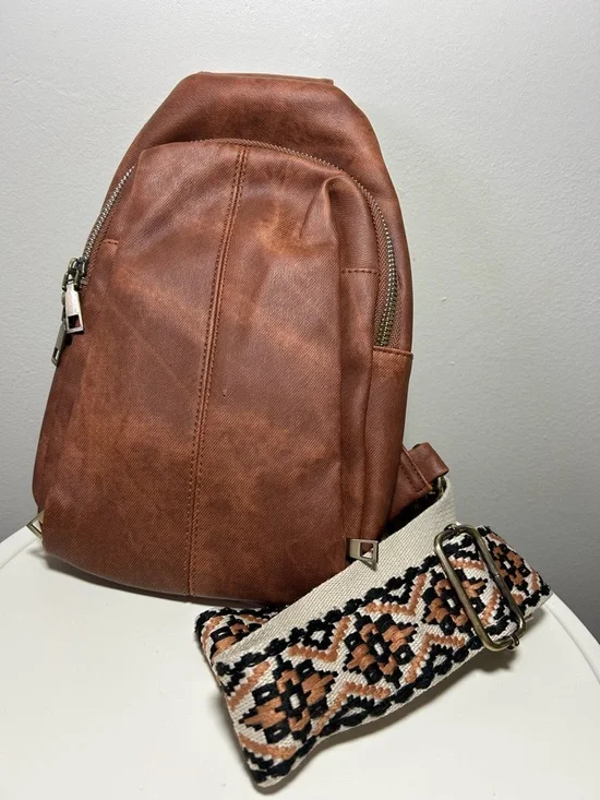 Brown Faux Leather Sling Backpack with Patterned Strap