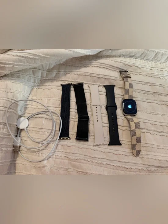 Apple Watch with Black, Beige, White and Checkered Bands
