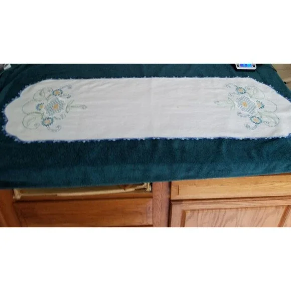 vintage handmade floral needlework table runner with a crocheted border