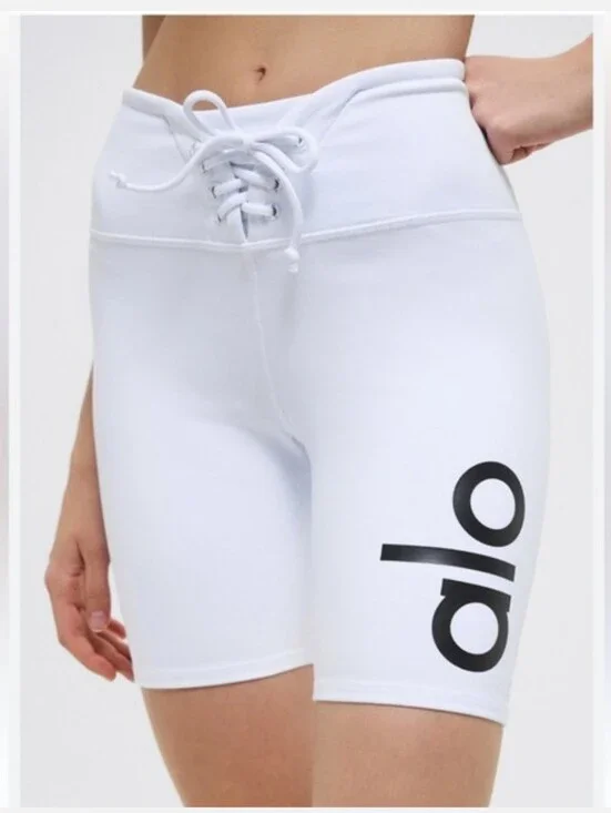 ALO Yoga Lace-Up High-Waist Bike Shorts in White with Black Logo