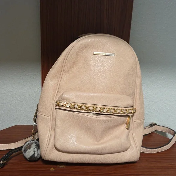 Elegant Light Pink Backpack with Gold Accents