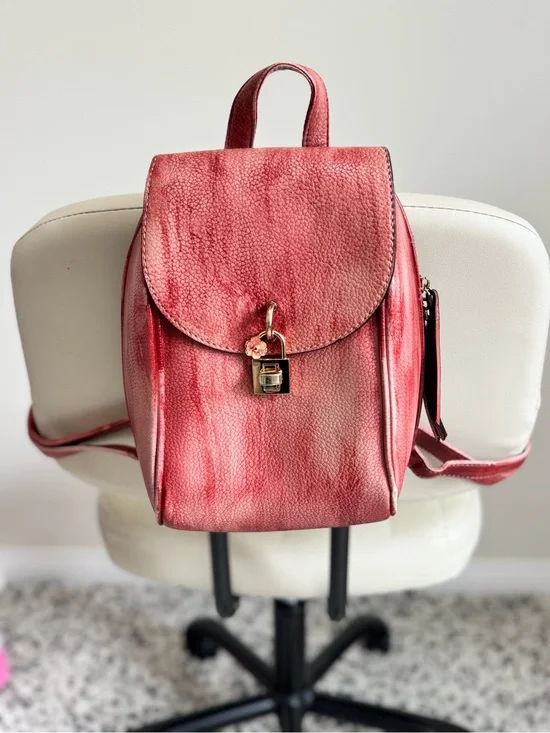 Distressed Circle Backpack With Red Flower lock Accent