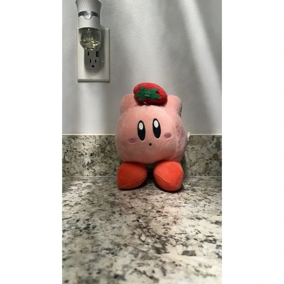 Kirby with strawberry plush