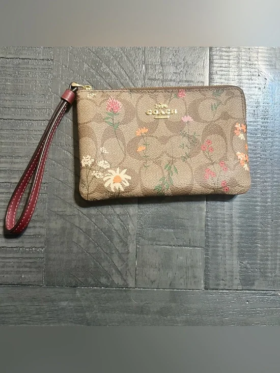 COACH Brown Floral Signature Wristlet with Burgundy Strap