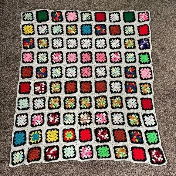 Colorful black/cream granny square blanket