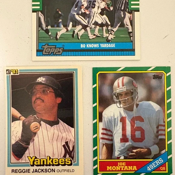 Three Sports Trading Cards: Joe Montana, Bo Jackson (Football), Reggie Jackson
