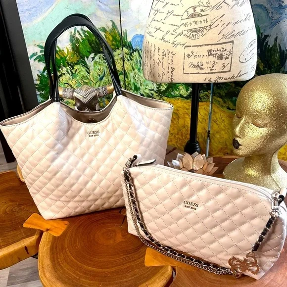 Guess two-piece purse set with leather and metal straps.