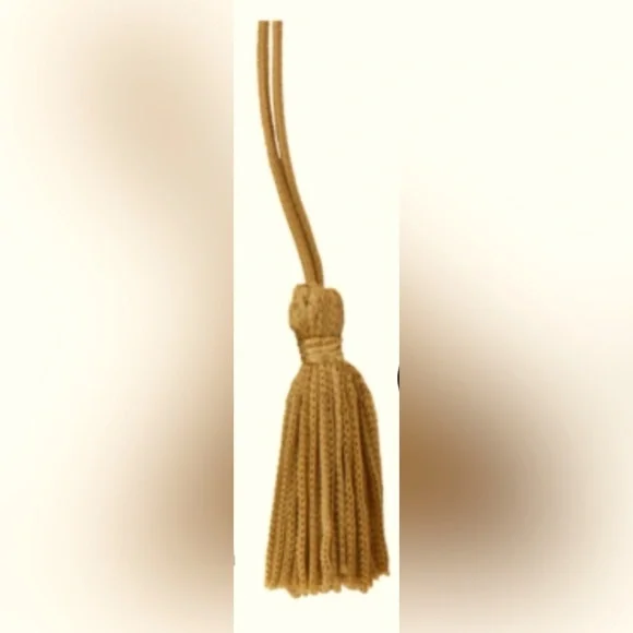 Tassels in Old Gold color. 8” Elastic loop with 2in rayon tassels. 25 in a pack.