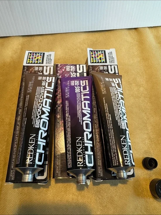 Redken Chromatics Hair Color Tubes in Metallic Brown and Deep Purple