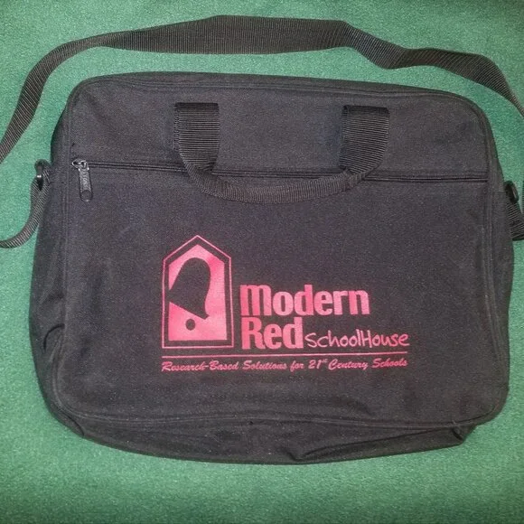 large black bag with straps, and ink-stained interior