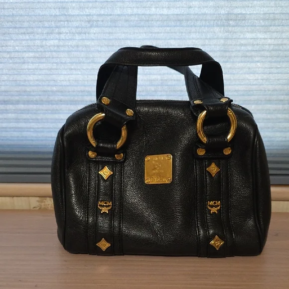 MCM Black and Gold Satchel with Structured Design