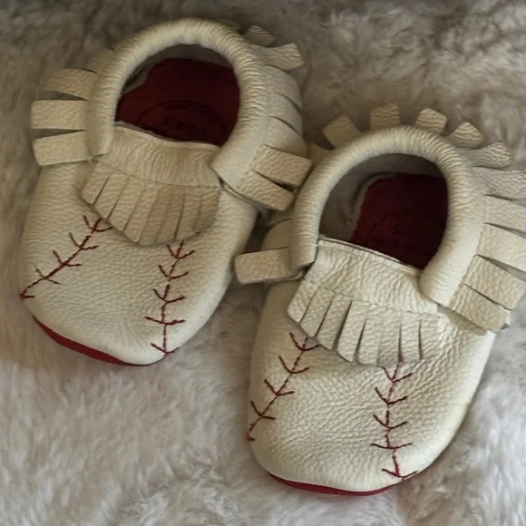 BirdRock Baby Home Run genuine leather baby moccasins with a baseball design.