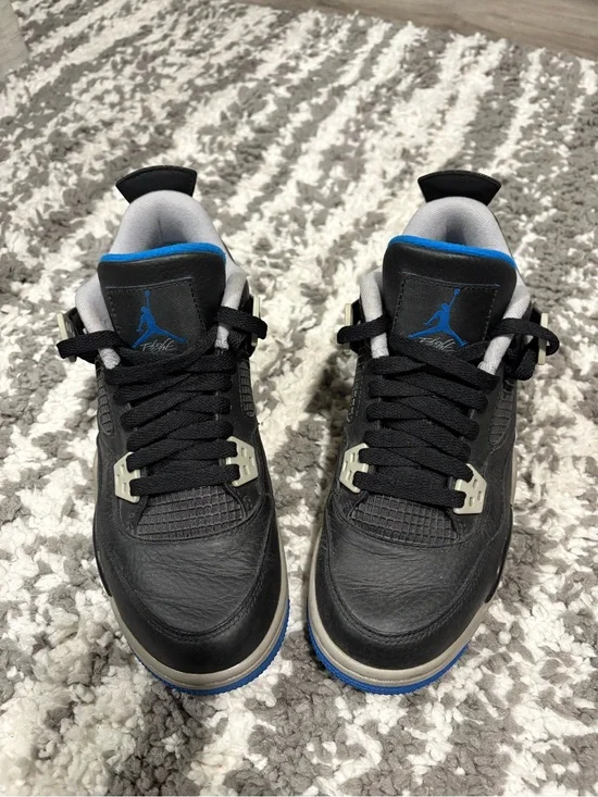Nike Kids Black Sneakers with Blue Accents