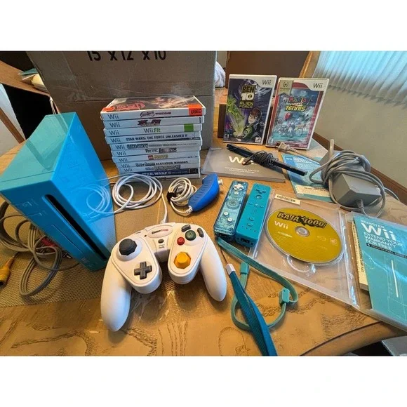 Nintendo Wii. Rare blue limited edition console bundle with Wii box. Many games