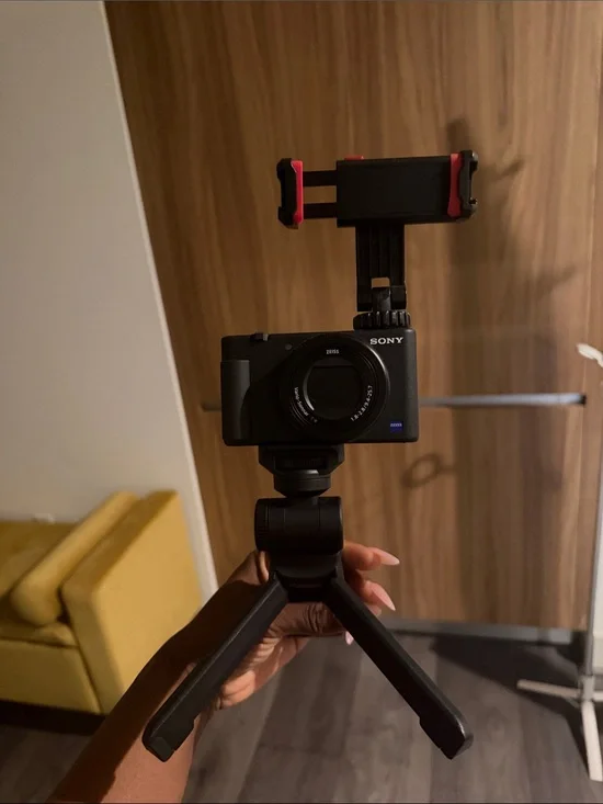 Sony Black Compact Digital Camera with Red-Accent Phone Mount and Mini Tripod