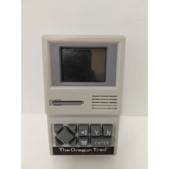 The Oregon Trail Handheld Electronic Game Basic Fun 09597 Retro Travel Toy Grey