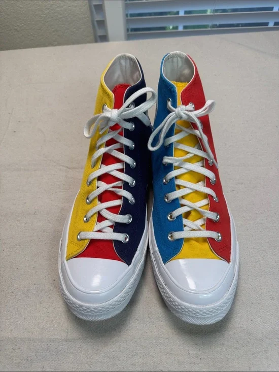 Converse All Star Chuck Golf Wang High Top Sneakers in Yellow, Blue, and Red.