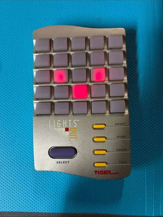 Tiger Lights Out Handheld Game - Silver with Purple Buttons MEMORY LANE!!!