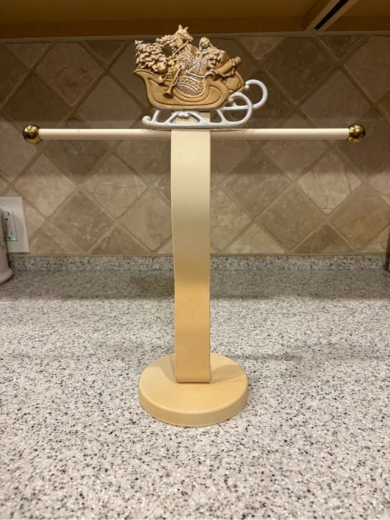 Decorative metal towel stand featuring Santa On A Sleigh