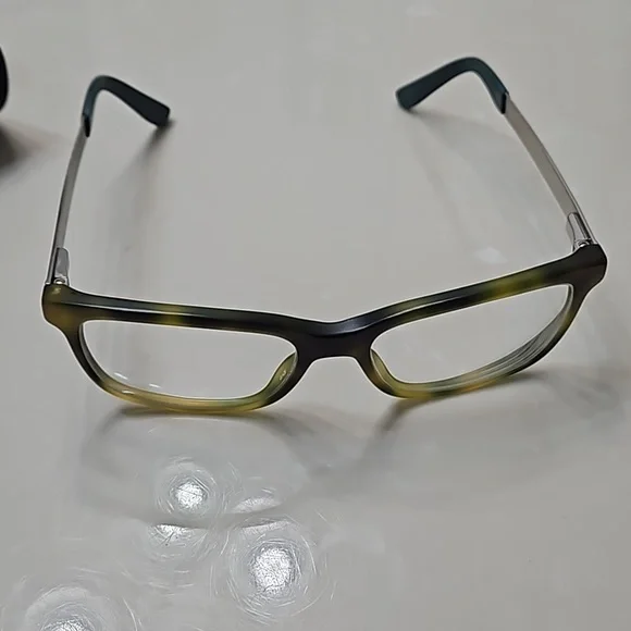 Tommy Hilfiger yellow and brown plastic frame glasses with case.