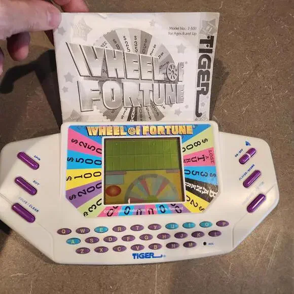 Wheel of Fortune Handheld Electronic Game works perfect EUC condition booklet