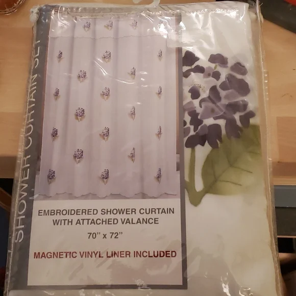 Shower curtain with magnetic liner