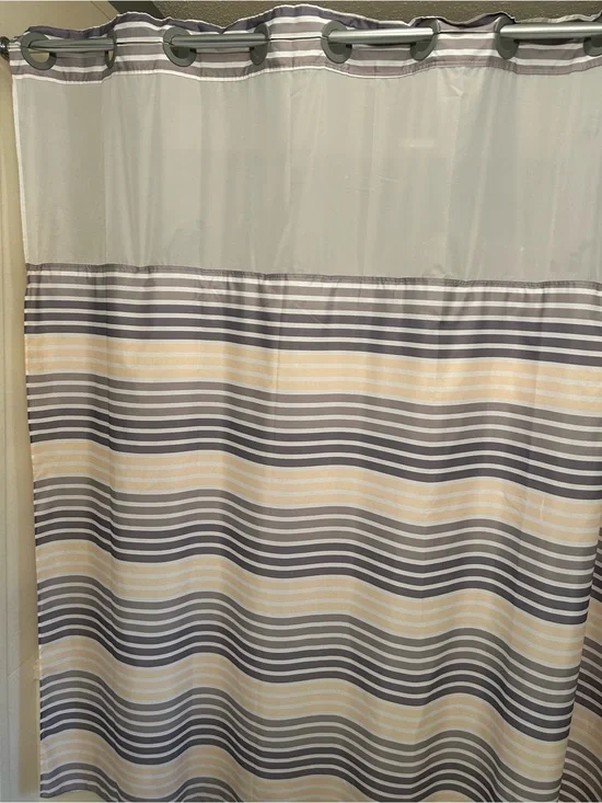 Striped Hookless Shower Curtain in Gray, white and yellow stripes.