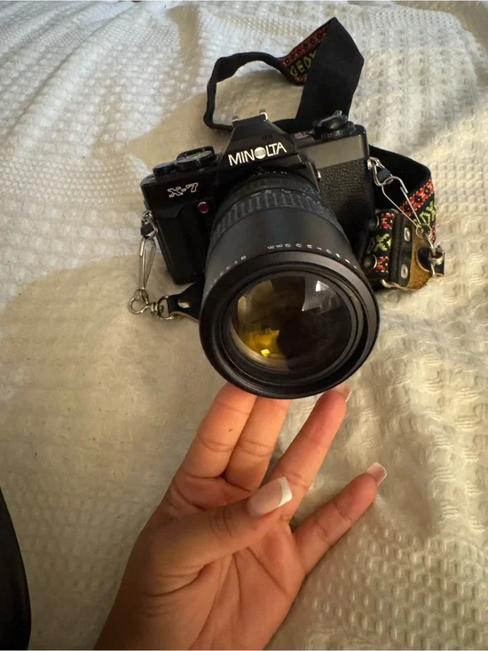 X-7 Minolta Black SLR Camera with Telephoto Lens
