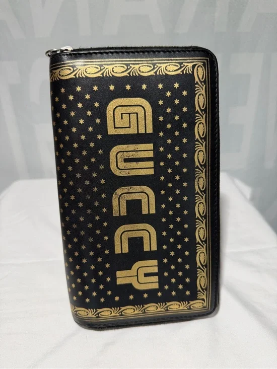 Gucci Black and Gold Zip-Around Logo Wallet